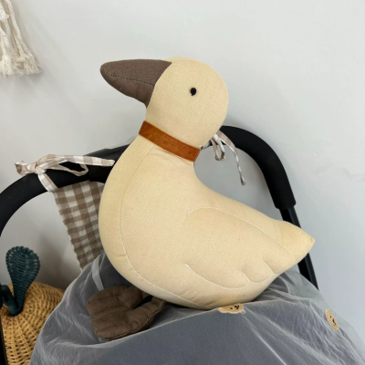 présentation du doudou canard tête clair
