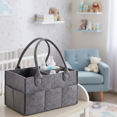 Panier rangement bebe gris sur la table à langer